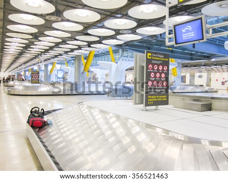 MADRID, SPAIN - CIRCA JULY, 2011: A view of the area where tourists arriving in Madrid Airport Barajas claim their baggage.