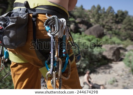 Man wearing climbing harness