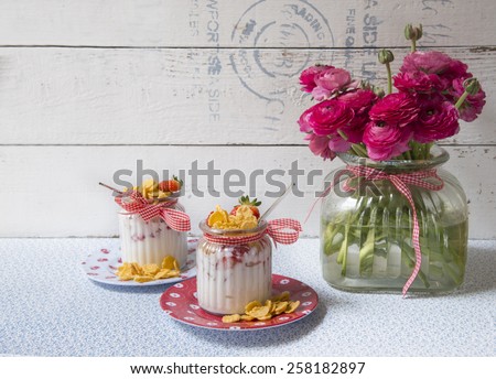 yogurt with strawberries corn flakes and meringue