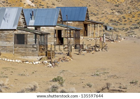 Ghost town cabins in abandoned mining camp in the Nevada desert.