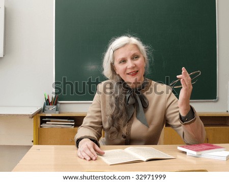 School teacher lady apparently explaining something to the class