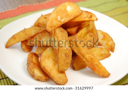 Plateful of seasoned potato wedges
