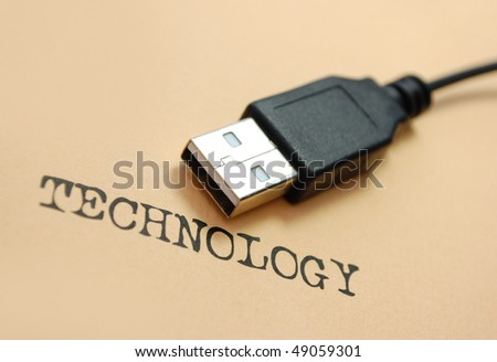 USB cable near to the word technology typed in an old font