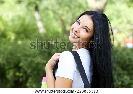 Happy young student in the park