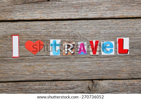 The word I love travel in cut out magazine letters