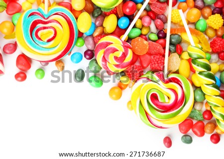 Different fruit candies on white background