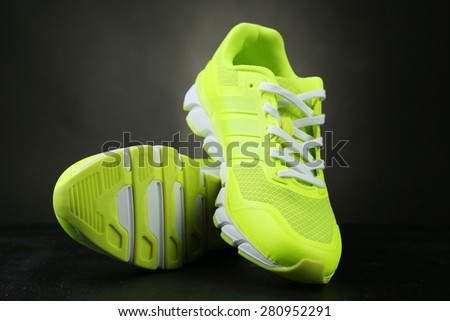 Pair of sport shoes on black background