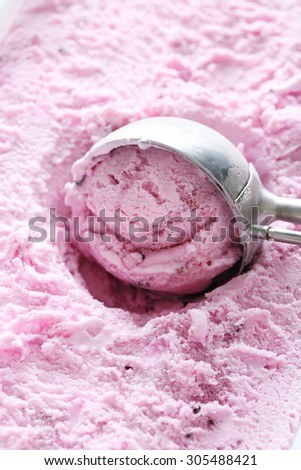 Sweet ice cream scooped out from container
