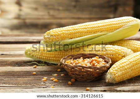 Corns on a brown wooden background