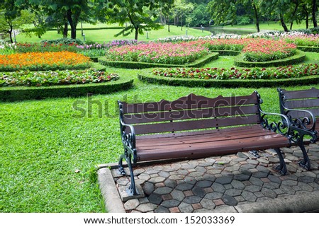 Vintage Bench in flower garden.Vintage Bench in tulips garden.