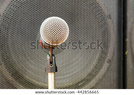 Close up of microphone in concert hall or conference room. Music equipment in training room.