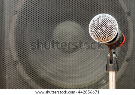 Close up of microphone in concert hall or conference room. Music equipment in training room.