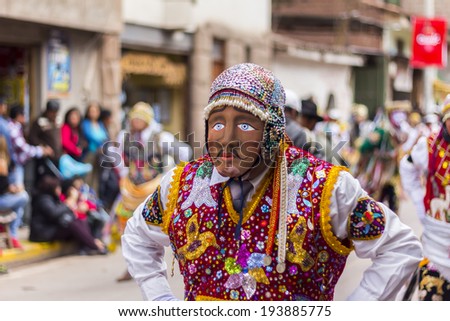PISAC, PERU - JULY 16, 2013: masked dancers at Virgen del Carmen parade
