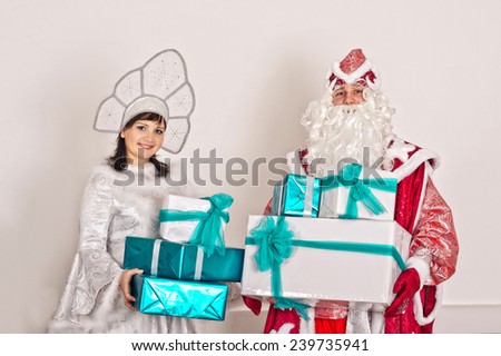 The guy and the girl in New Years fancy dresses have control over gifts.