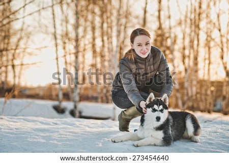 Walk with a dog in the winter.