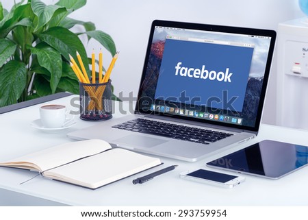 Facebook new logo on the Apple MacBook Pro Retina with an open tab in Safari browser that is on office desk. Facebook is the most popular social network in the world. Varna, Bulgaria - May 29, 2015.