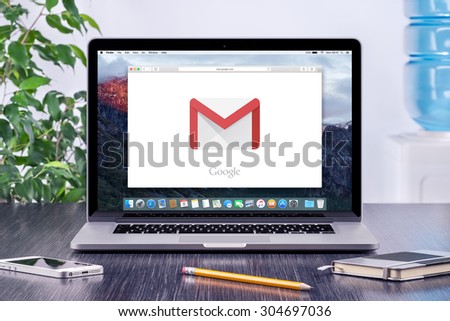 Google Gmail logo on the Apple MacBook Pro display that is on office desk workplace. Gmail is a free e-mail service provided by Google. Varna, Bulgaria - May 31, 2015.