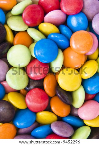 Background image of sweet smarties or chocolate buttons
