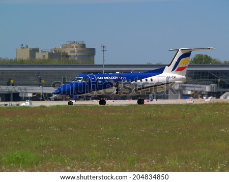 Borispol, Ukraine - May 9, 2014: Air Moldova Airlines Embraer EMB-120RT Brasilia aircraft preparing for take-off from the runway of Borispol International Airport on May 9, 2014. Editorial use only