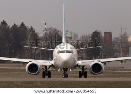 KIEV, UKRAINE - MARCH 15, 2015: Flydubai Boeing 737 Next Gen, 7000th 737 aircraft in Boeing family running on the runway of Kiev International Airport on March 15, 2015. Editorial use only