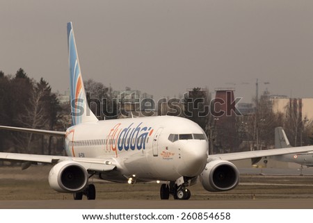 KIEV, UKRAINE - MARCH 15, 2015: Flydubai Boeing 737 Next Gen, 7000th 737 aircraft in Boeing family running on the runway of Kiev International Airport on March 15, 2015. Editorial use only