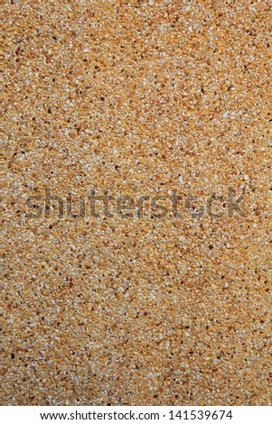 small rocks and fine stone in the yellow cement