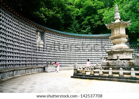 SEOUL, SOUTH KOREA - JUNE 27: Korean people praying the pagoda and the million of rock little buddha in the temple, on June 27, 2009 in Seoul, Korea