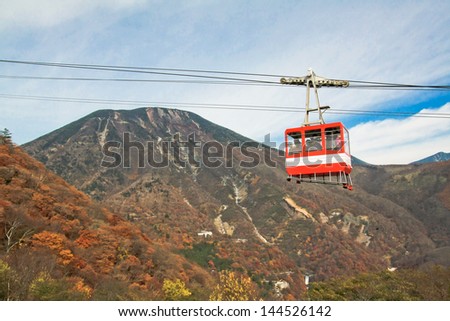 NIKKO, JAPAN - NOV 5: People taking on the cable car to see the top view of Nikko city and the famous waterfall on the mountain on November 5, 2011.