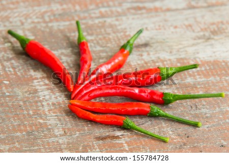 Red chillies on wood table