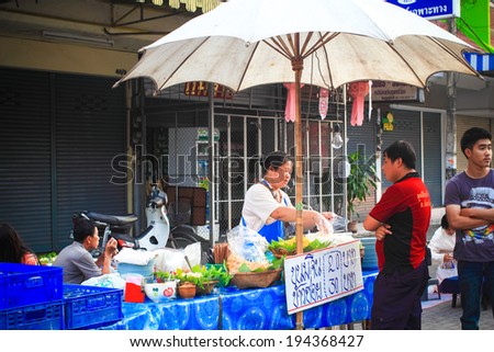 CHIANG MAI, THAILAND - MAY 4: Local food shop on Chiangmai Sunday walking street on MAy 04, 2014 in Chiang Mai, Thailand. Market is opened every Sunday from 4pm till midnight.