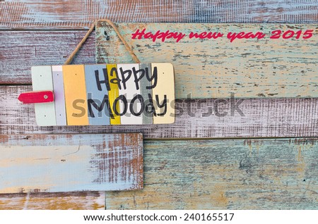 Happy new year card, Happy or Moody sign board on wooden vintage background.