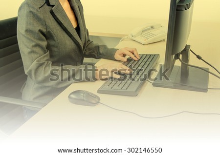 businesswoman with computer in office  - vintage effect style pictures