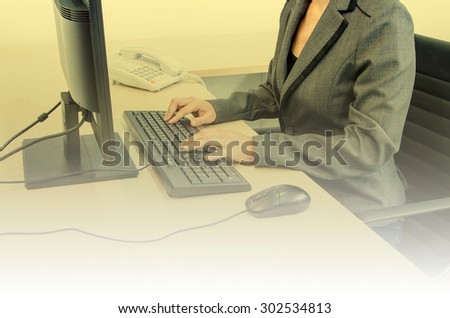 businesswoman with computer in office  - vintage effect style pictures