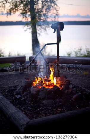 Bonfire at dusk on the lake