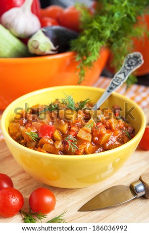 Vegetable stew (Ratatouille) in yellow bowl on the table