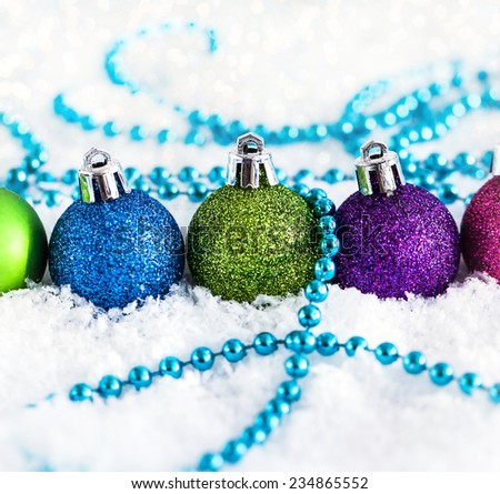 Christmas balls and garland on the snow