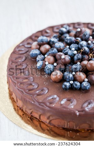 Homemade chocolate cake (Bird`s milk) with fresh berries and christmas decoration