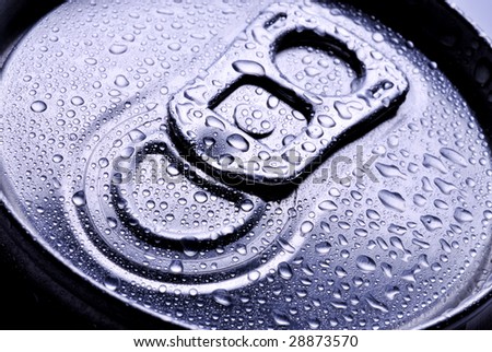 Close up of a metal pop top from a beverage can with drops