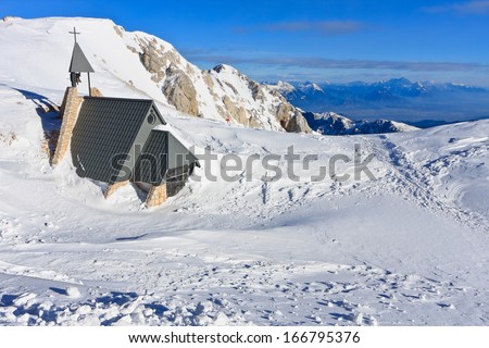 A small chapel with the bell on Kredarica at 2500m above sea level in high mountains in Triglav national park, Slovenia