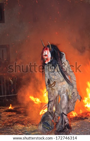 PODKOREN, SLOVENIJA - NOVEMBER 29th: Unidentified man wears Krampus (devil) mask at traditional procession on November 29th 2013 \