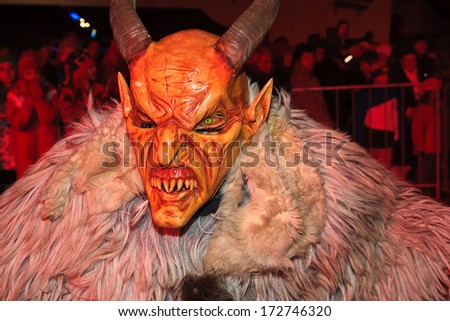 PODKOREN, SLOVENIJA - NOVEMBER 29th: Unidentified man wears Krampus (devil) mask at traditional procession on November 29th 2013 \
