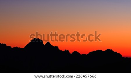 Mountain silhouette in the afterglow. View from the Gartnerkofel above Nassfeld pass, Austria