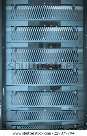 Hard disks stacked in computer storage disk array in the computer rack