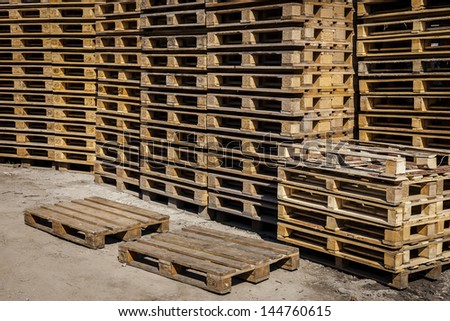 Wooden transport pallets in stacks ready for delivery. Two palettes in the foreground.