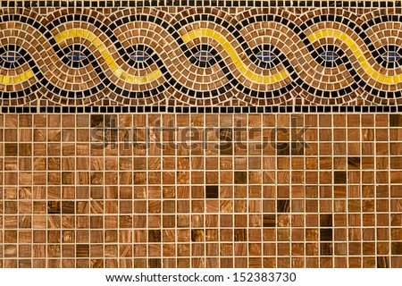 Mosaic in ancient style stacked with tiny brown, yellow, blue tiles. Background with mosaic tiles with ornament.