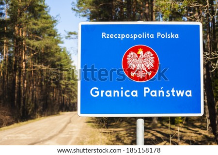 Border with emblem of the Poland. Road and forest in background.