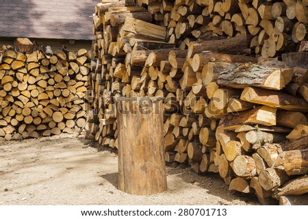 Accumulated felling the tree trunks. Wood for fuel and for fireplaces.