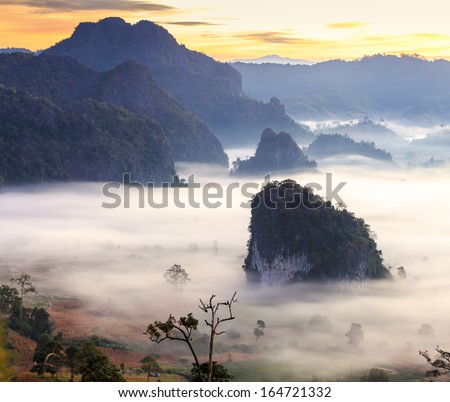 morning mist cover tree and mountain at Phu Lang Ka, Phayao, Thailand