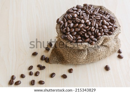 Coffee beans in brown bag. culinary coffee still life.