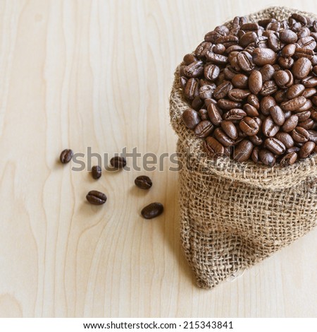 Coffee beans in brown bag. culinary coffee still life.
